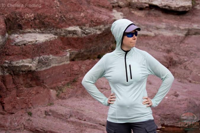 Lady wearing Minus 33 merino wool Sun Hoodie.