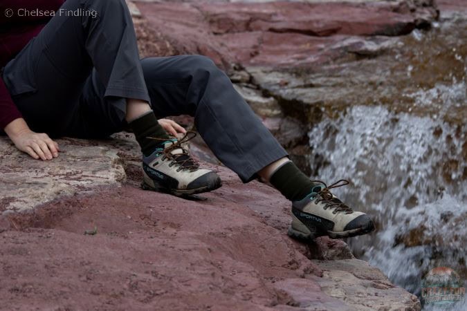 Merino wool crew socks are in hiking shoes on Red Rock Canyon.