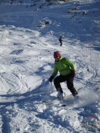 Woman downhill skiing