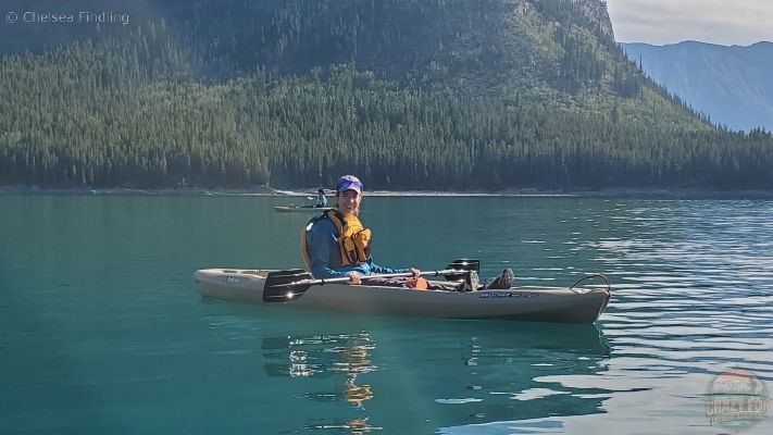 Lady relaxing on the water while kayaking