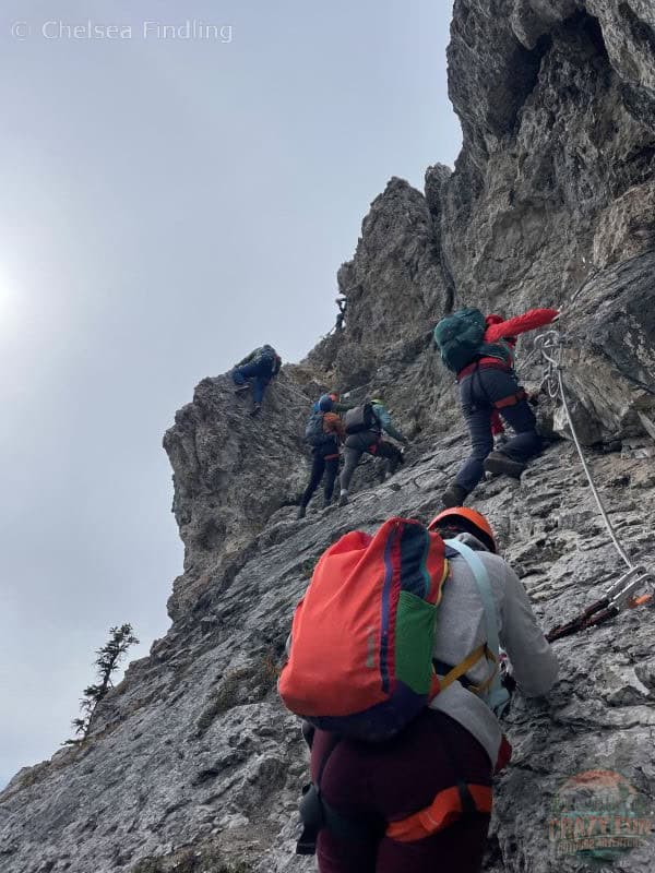 Ladies climbing up the Via Ferrata on Banff's 3 days summer itinerary.