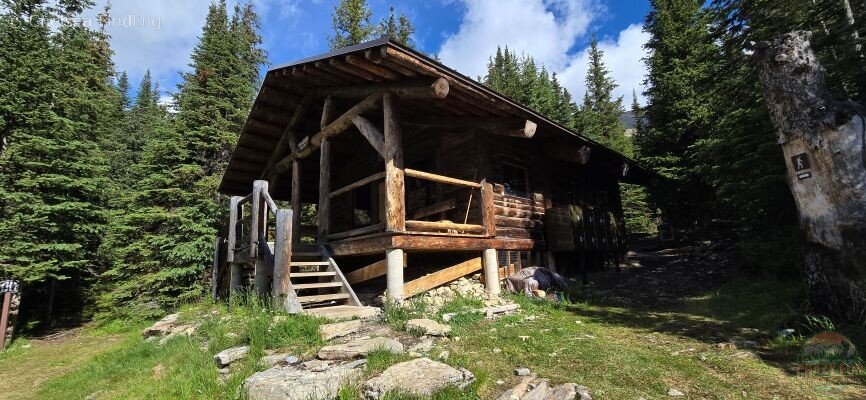 Rustic hut at Berg Lake campground used by hikers for shelter and meal breaks.