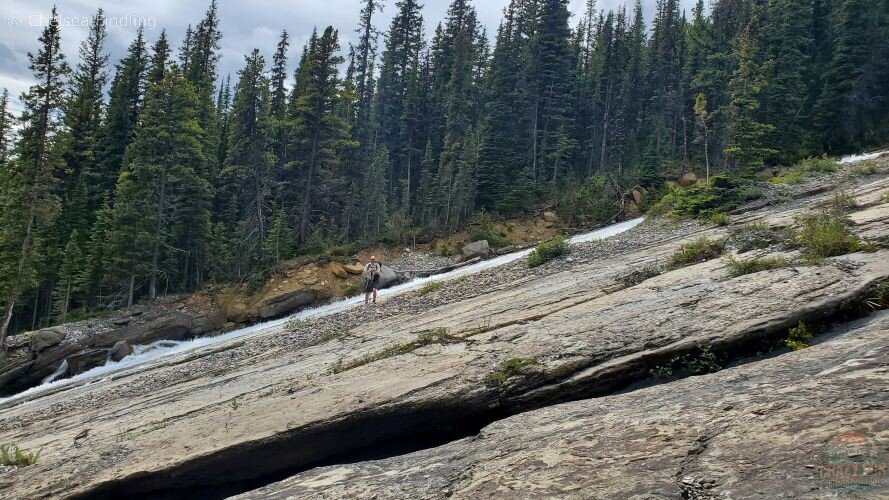 Toboggan Falls cascading at a slanted angle down the rocky slope.