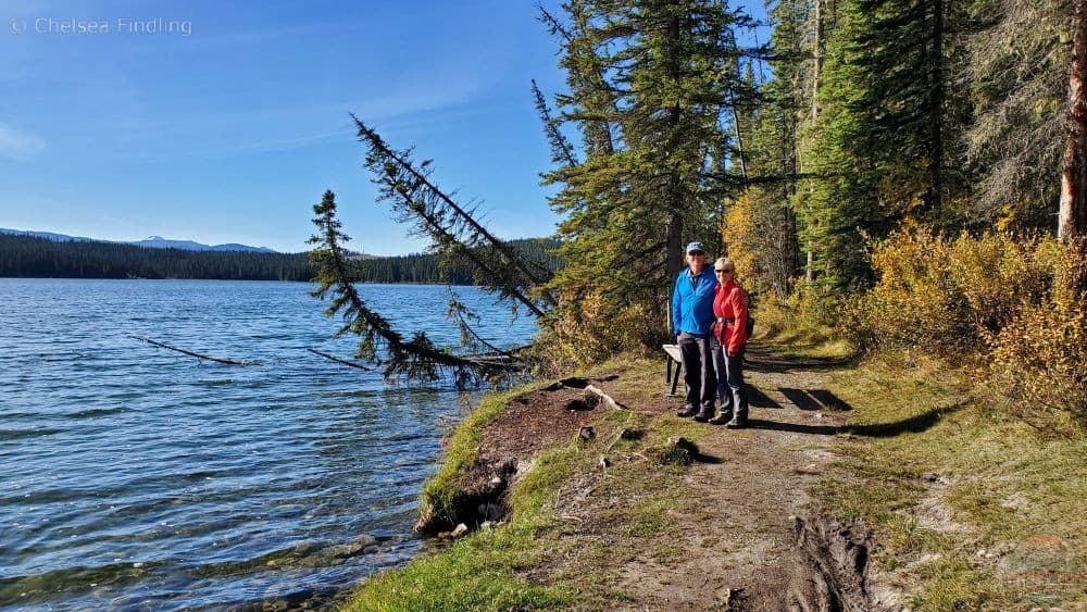 A couple on their outdoor adventures hiking the Shunda Lake trail. 
