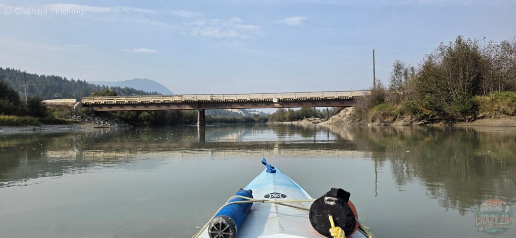 Sign on bridge indicating the take-out point for kayakers.
