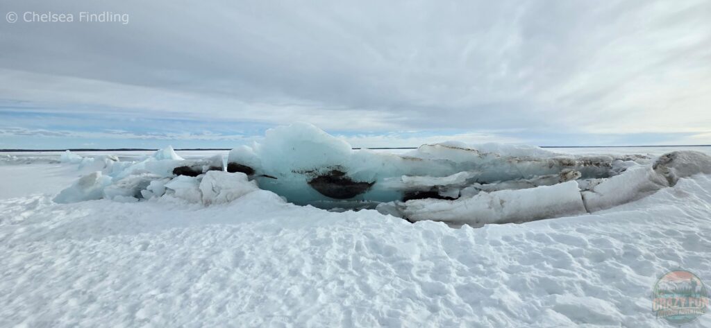 Ice formations protruding out of the water. 